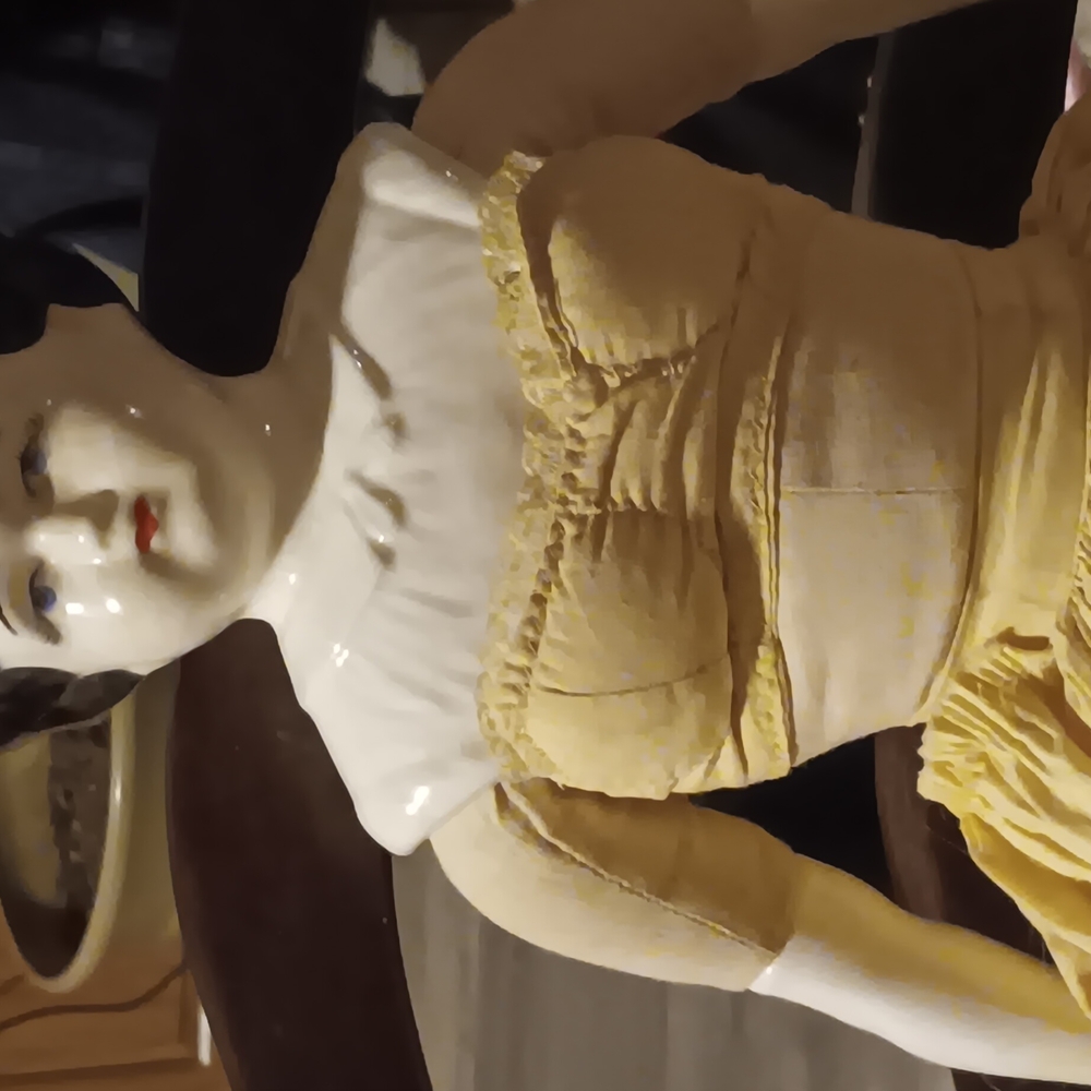 Elegant Yellow Porcelain Figurine